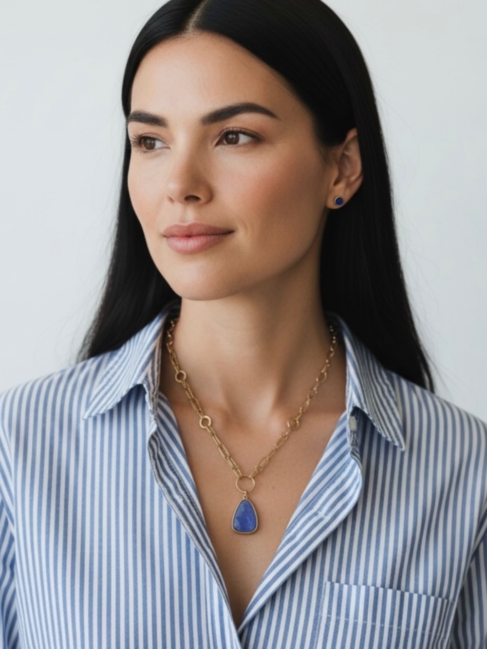 Goldtone Double Chain Necklace with a Blue Glass Pendant by Plunder Design